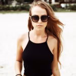 serious-long-haired-woman-beach_1140-265